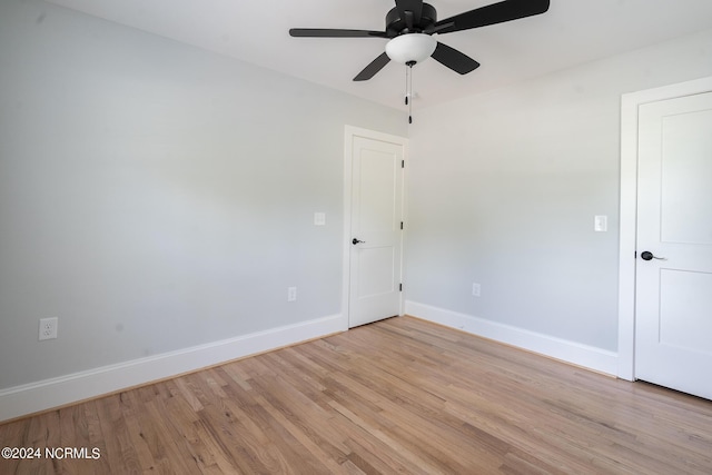 empty room featuring ceiling fan and light wood-type flooring