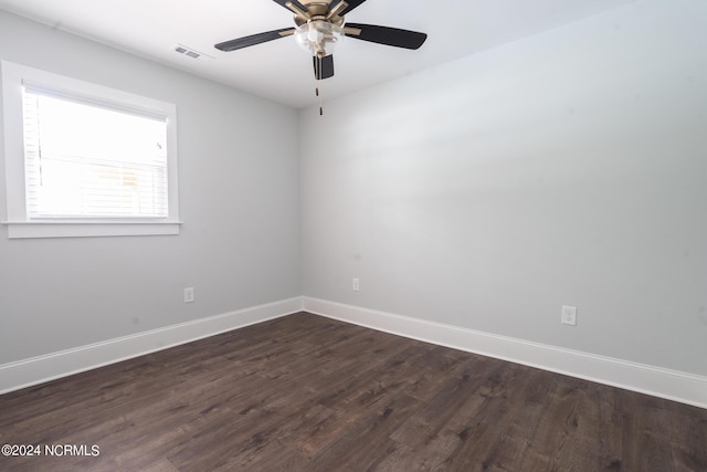 unfurnished room with dark hardwood / wood-style flooring and ceiling fan