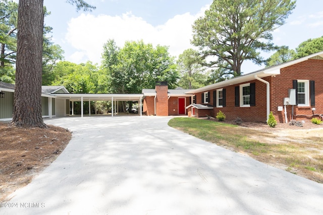 ranch-style home with a carport