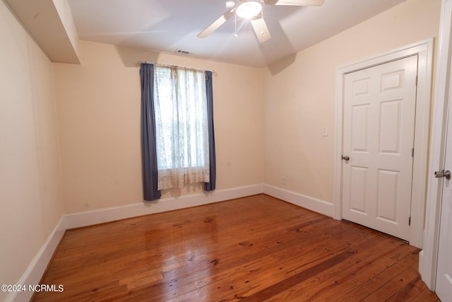 unfurnished room with ceiling fan and wood-type flooring