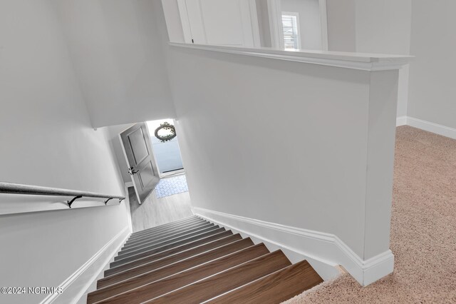 stairway featuring baseboards