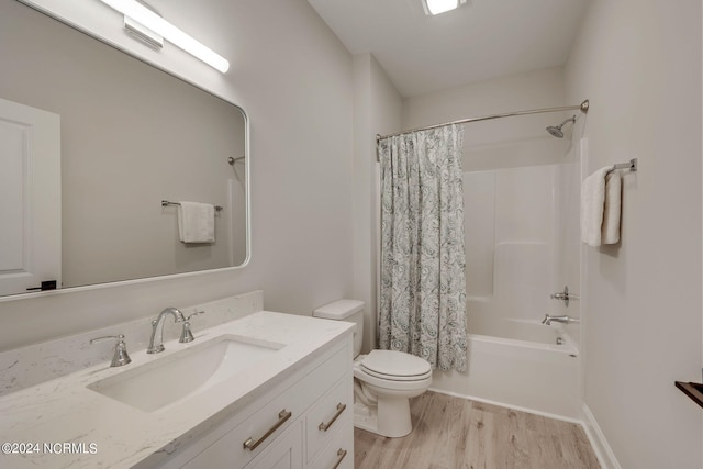 full bathroom featuring wood-type flooring, vanity, toilet, and shower / bath combination with curtain