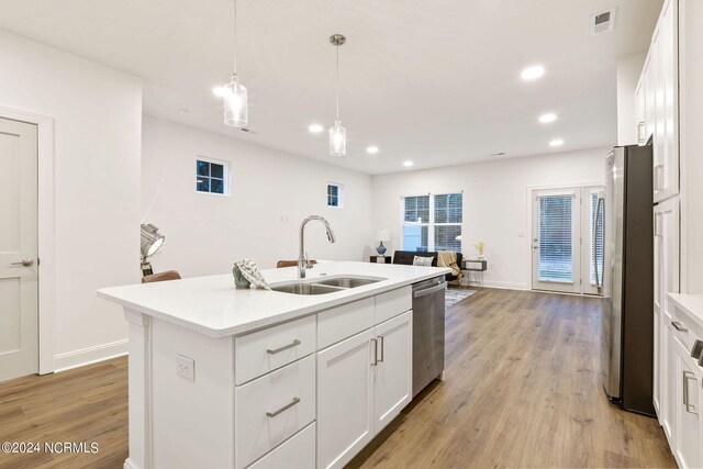 spare room with a healthy amount of sunlight and dark hardwood / wood-style floors