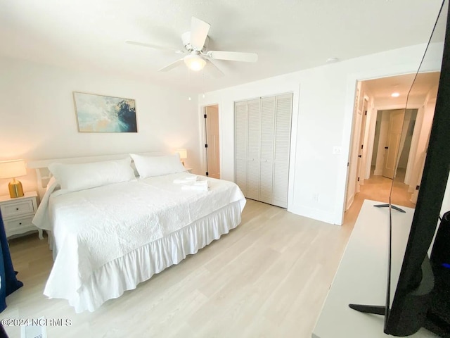 bedroom featuring a closet, ceiling fan, and light hardwood / wood-style floors