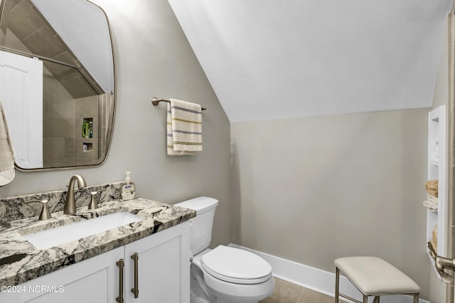 full bath with baseboards, tiled shower, toilet, lofted ceiling, and vanity