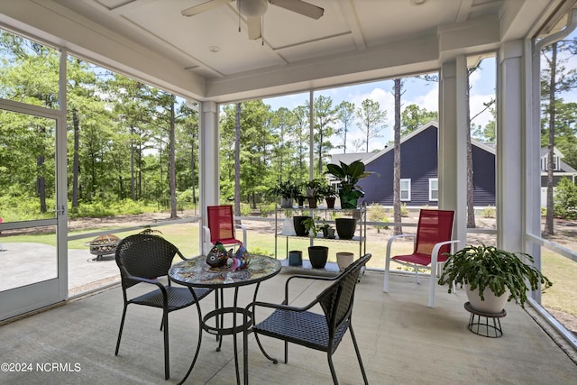 sunroom / solarium featuring ceiling fan