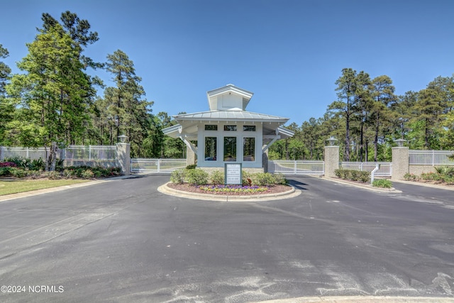 view of property with fence