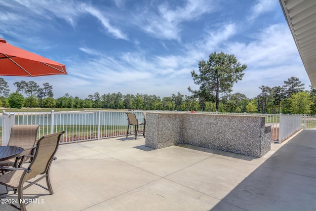 view of patio featuring fence