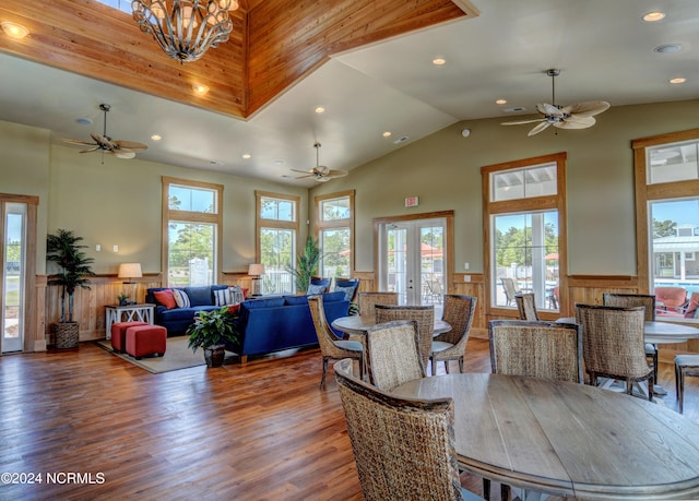 dining area with recessed lighting, wainscoting, a notable chandelier, and wood finished floors