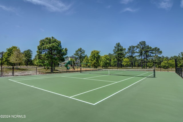 view of tennis court with playground community, fence, and community basketball court