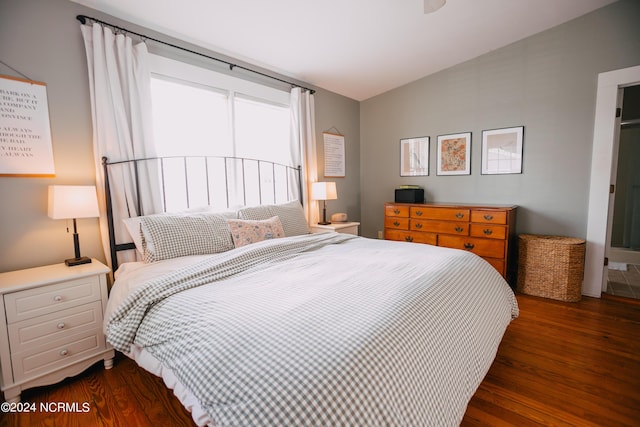 bedroom featuring dark hardwood / wood-style flooring