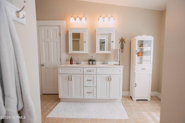 bathroom featuring tile patterned flooring and vanity