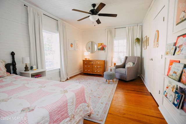 bedroom featuring hardwood / wood-style floors and ceiling fan