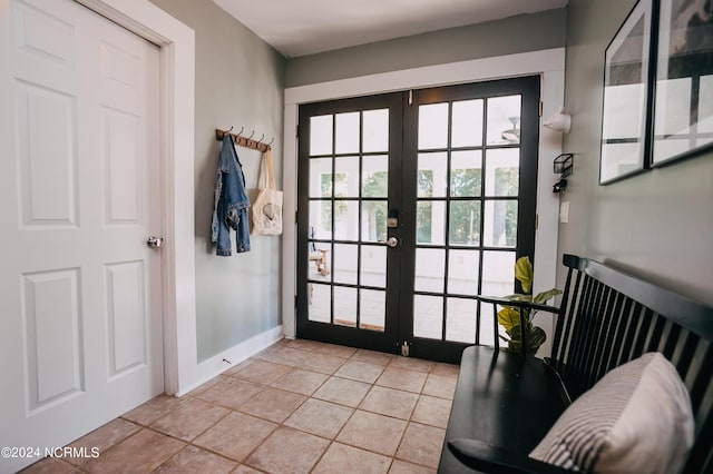 doorway to outside with french doors and light tile patterned floors