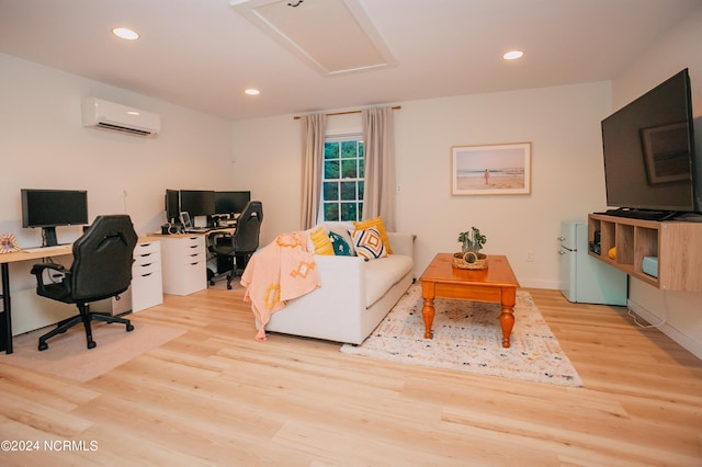 office featuring a wall mounted air conditioner and light wood-type flooring