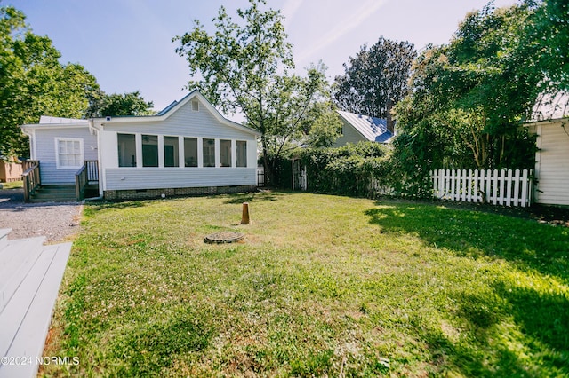 view of yard featuring a sunroom