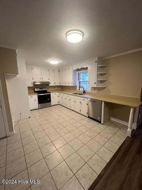 bathroom featuring vanity, crown molding, walk in shower, and tile walls