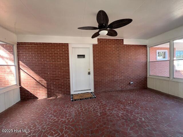 unfurnished room with ceiling fan, beam ceiling, dark hardwood / wood-style flooring, and wooden walls