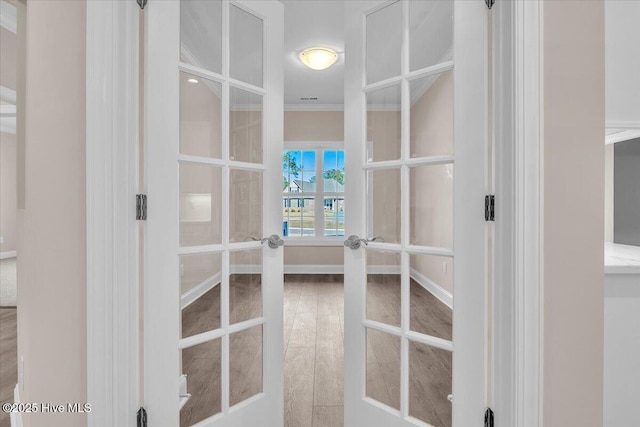 walk in closet featuring french doors