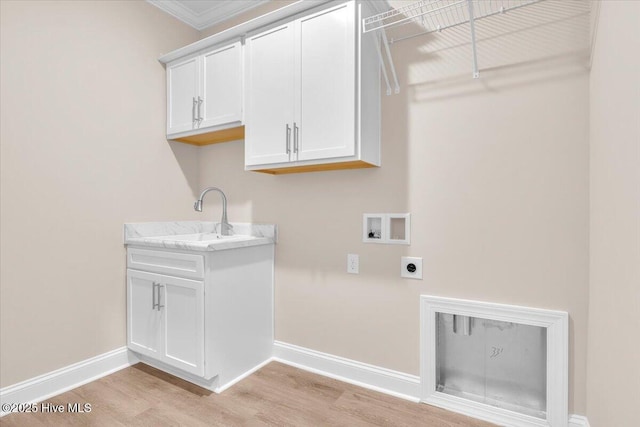 laundry room featuring hookup for a washing machine, baseboards, light wood-type flooring, cabinet space, and electric dryer hookup