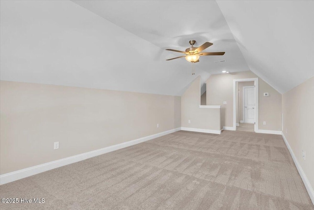 bonus room featuring vaulted ceiling, ceiling fan, carpet, and baseboards