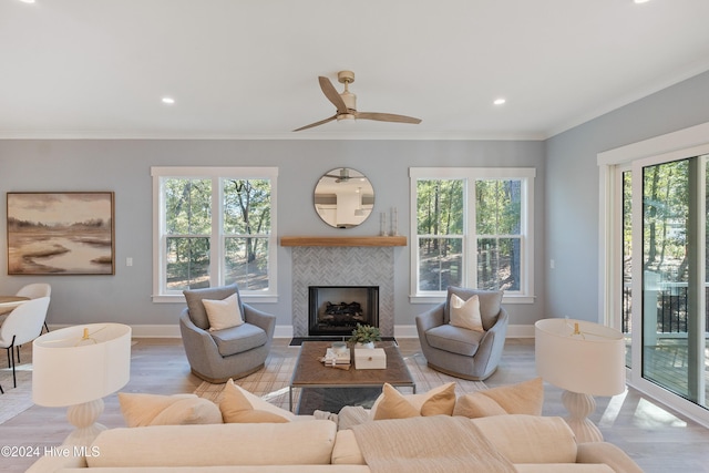 3617 Barnesmore Dr, Castle Hayne, NC 28429 - living area featuring ornamental molding, wood finished floors, a ceiling fan, a tiled fireplace, and recessed lighting