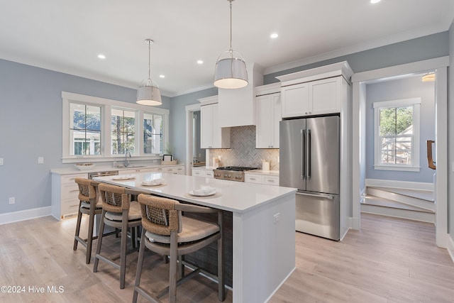 3617 Barnesmore Dr, Castle Hayne, NC 28429 - kitchen featuring high end refrigerator, a kitchen island, light countertops, tasteful backsplash, and stove