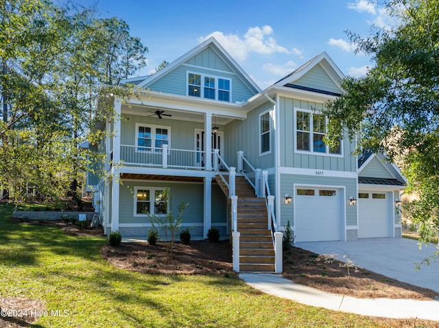 3617 Barnesmore Dr, Castle Hayne, NC 28429 - view of front of property with stairway, board and batten siding, a ceiling fan, a front yard, and a garage
