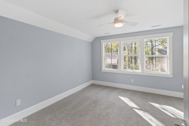 3617 Barnesmore Dr, Castle Hayne, NC 28429 - spare room featuring ceiling fan, carpet, baseboards, and vaulted ceiling