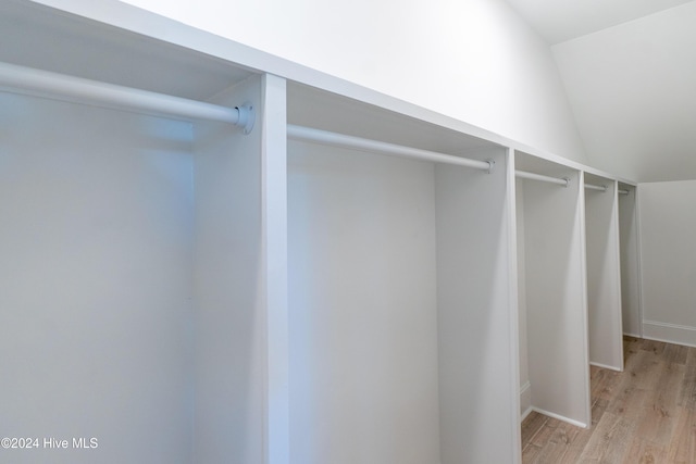 3617 Barnesmore Dr, Castle Hayne, NC 28429 - walk in closet featuring light wood-style flooring and vaulted ceiling