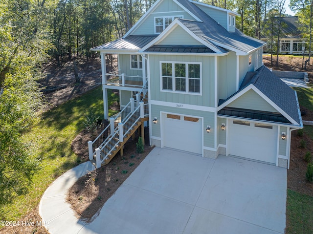 3617 Barnesmore Dr, Castle Hayne, NC 28429 - beach home with a standing seam roof, board and batten siding, stairway, and covered porch