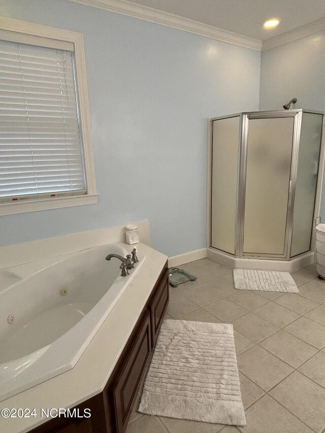 bathroom with independent shower and bath, ornamental molding, and tile patterned flooring