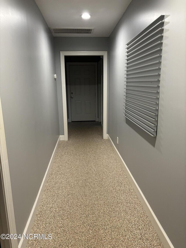 corridor featuring carpet flooring