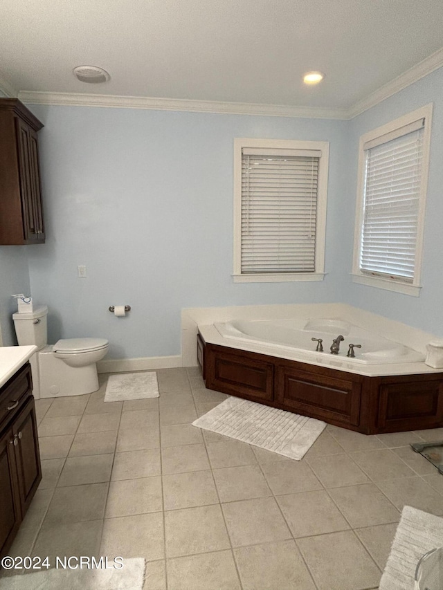 full bath with crown molding, vanity, tile patterned flooring, toilet, and a garden tub