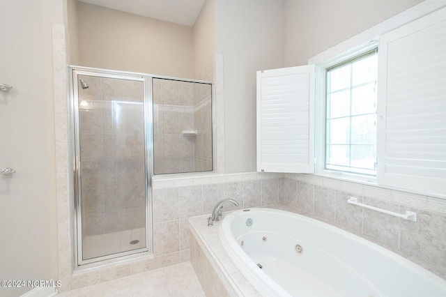 bathroom featuring tile patterned floors and shower with separate bathtub