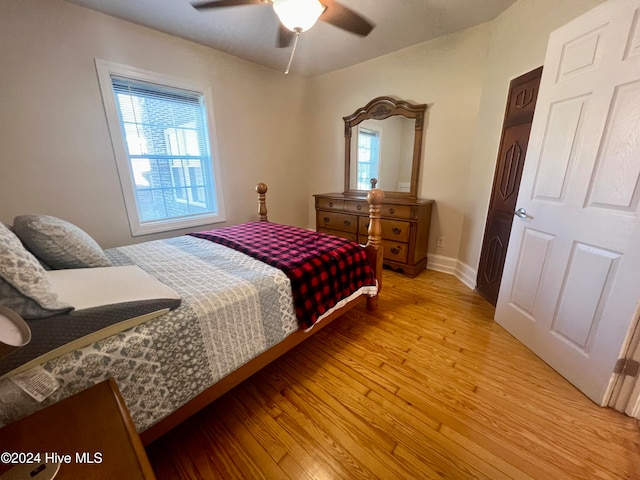 bedroom featuring light hardwood / wood-style flooring and ceiling fan