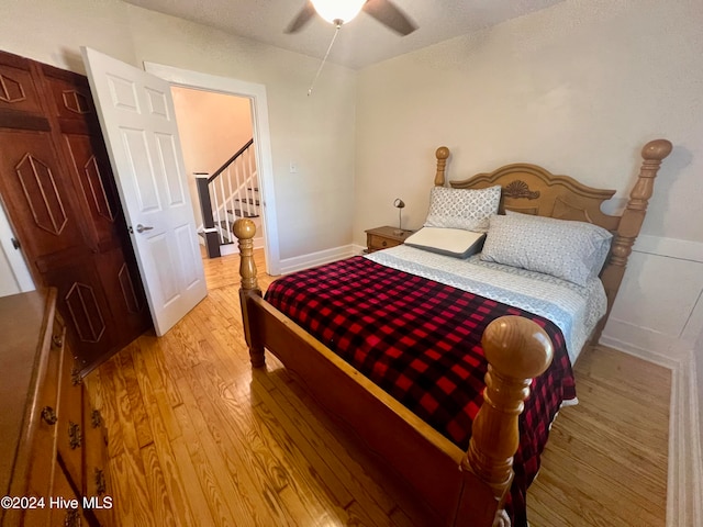 bedroom featuring ceiling fan and light hardwood / wood-style flooring