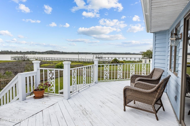 wooden terrace with a water view