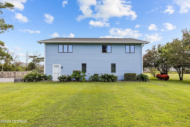 view of side of home featuring a lawn