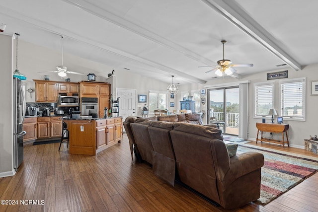 living room with lofted ceiling with beams, ceiling fan with notable chandelier, and dark hardwood / wood-style flooring