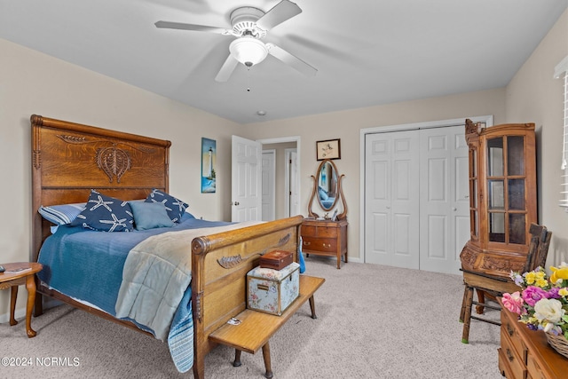 carpeted bedroom featuring a closet and ceiling fan