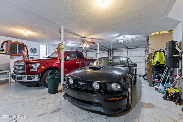 garage featuring a garage door opener and ceiling fan