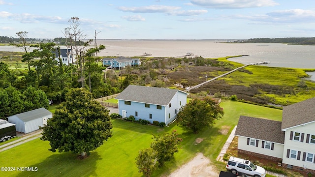 birds eye view of property with a water view