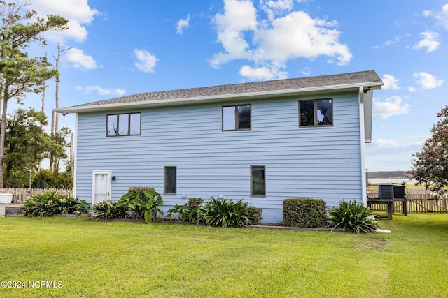 view of property exterior featuring a yard and cooling unit