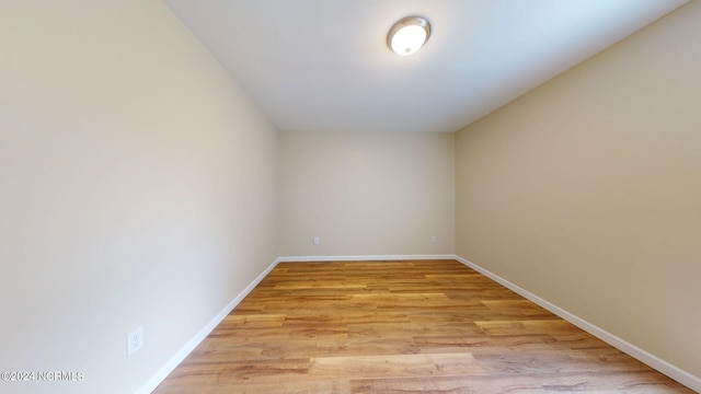 unfurnished room with light hardwood / wood-style flooring