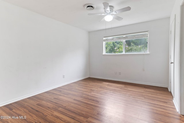 spare room featuring hardwood / wood-style flooring and ceiling fan