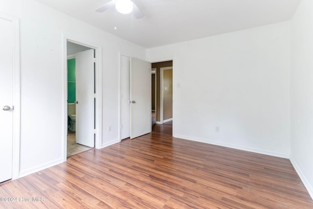 unfurnished bedroom featuring hardwood / wood-style flooring and ceiling fan