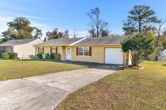 ranch-style home featuring a front lawn and a garage