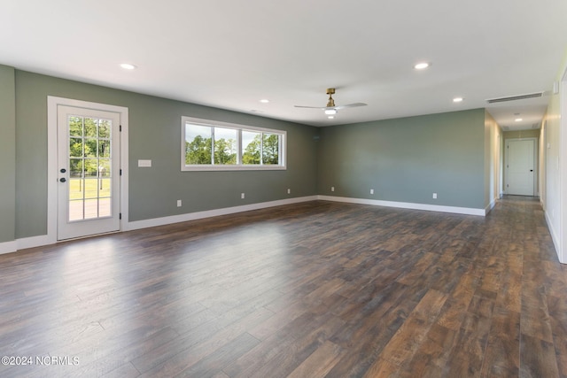 empty room featuring ceiling fan and dark hardwood / wood-style flooring