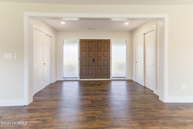 entryway with dark wood-type flooring